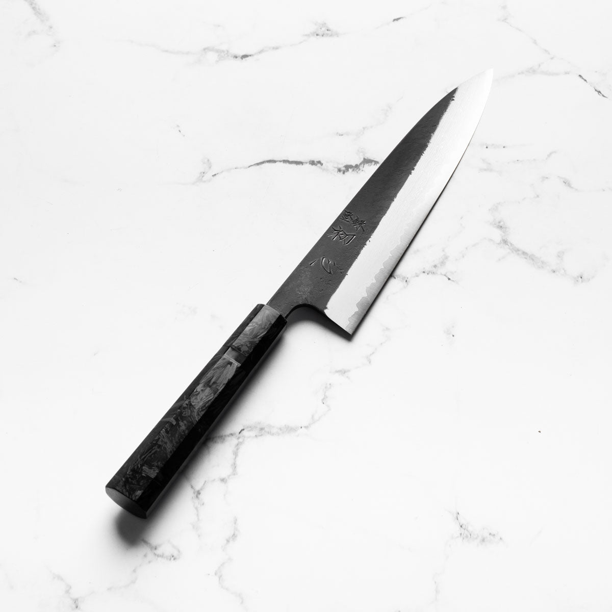 Hatsukokoro Shinkiro Blue Super Damascus Kurouchi Gyuto 210mm - Dark Carbon Fibre - angled view